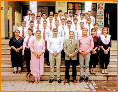 TMU college of management class with faculty